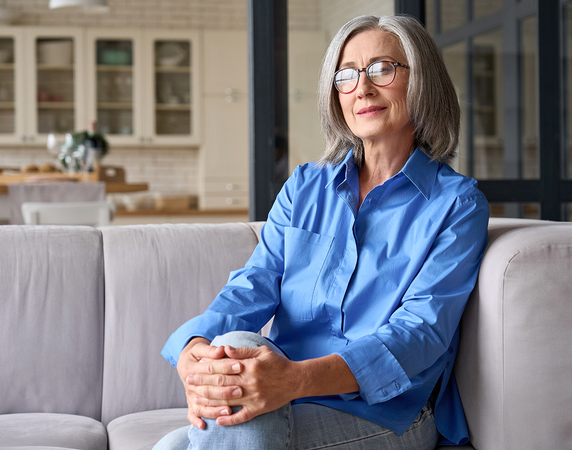 Woman sitting comfortably on couch